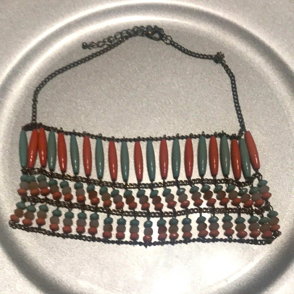 We are selling a multi colored neckled with many shapes